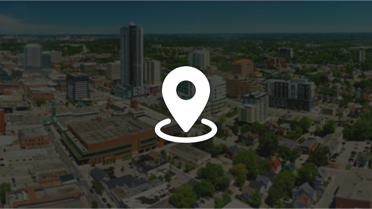 Aerial view of Kitchener-Waterloo with a pin icon